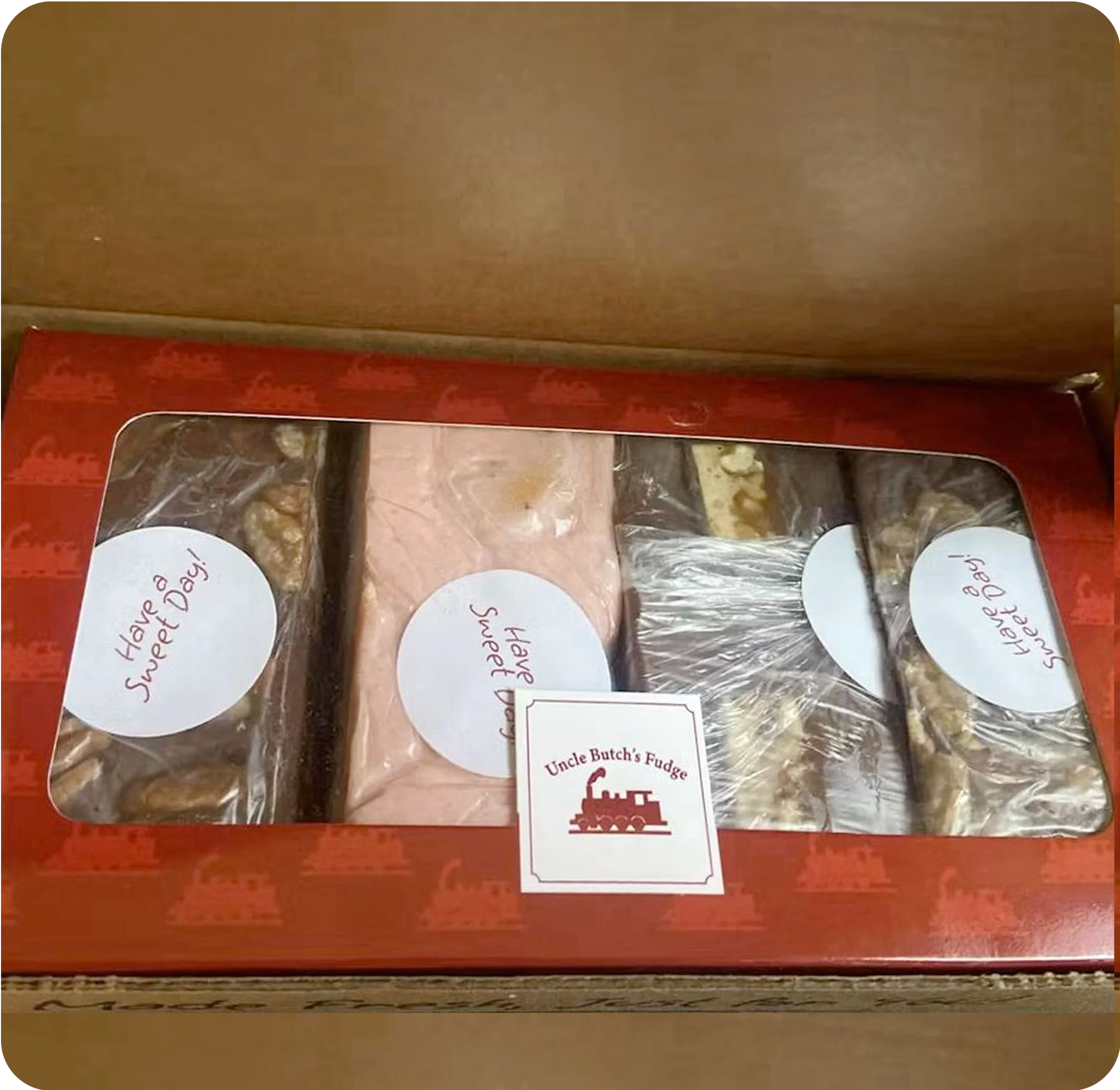 A box of assorted fudge with a label 'Have a Sweet Day.'