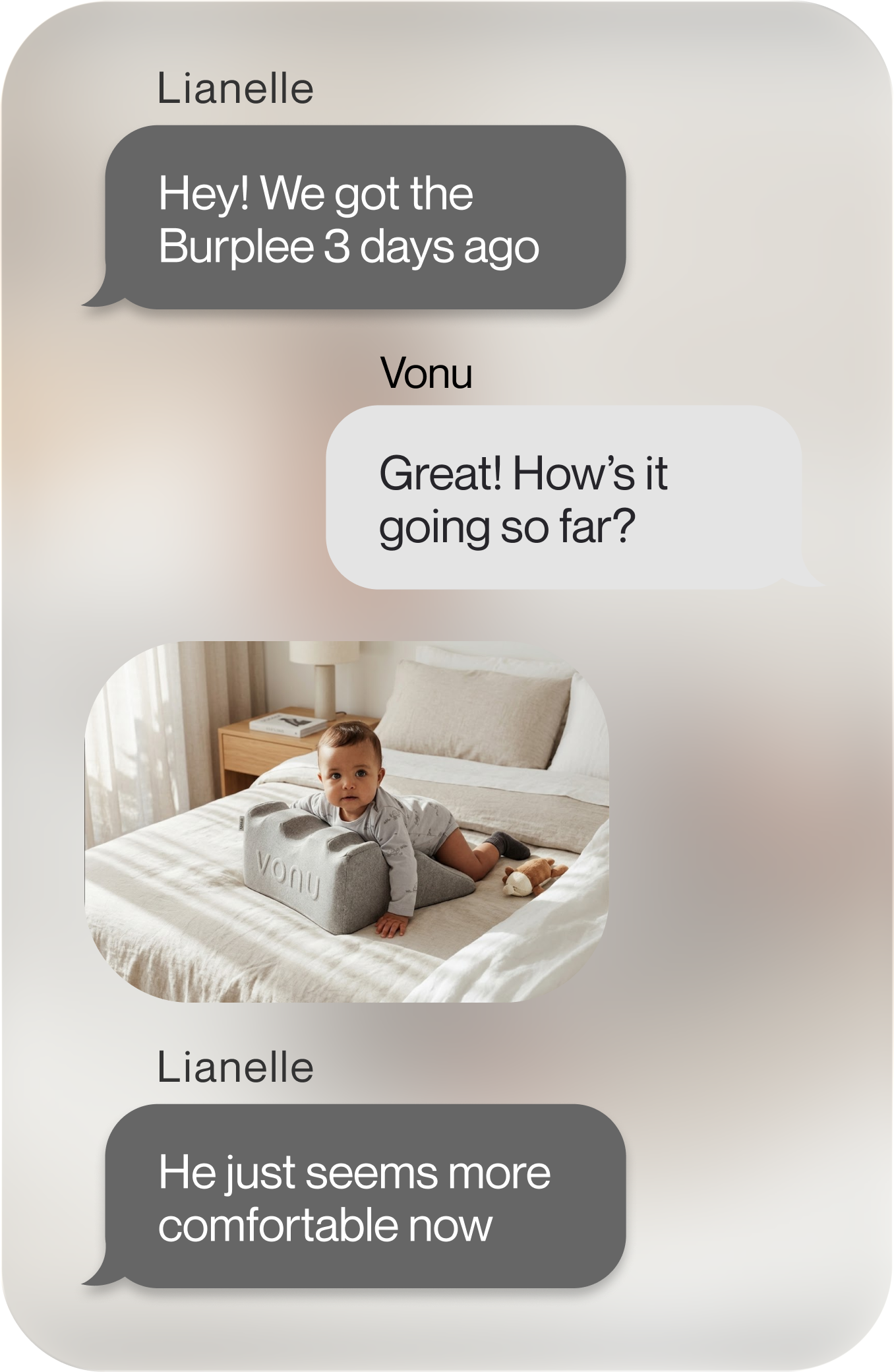 A text message conversation showing a photo of a baby lying on a gray support pillow on a bed.