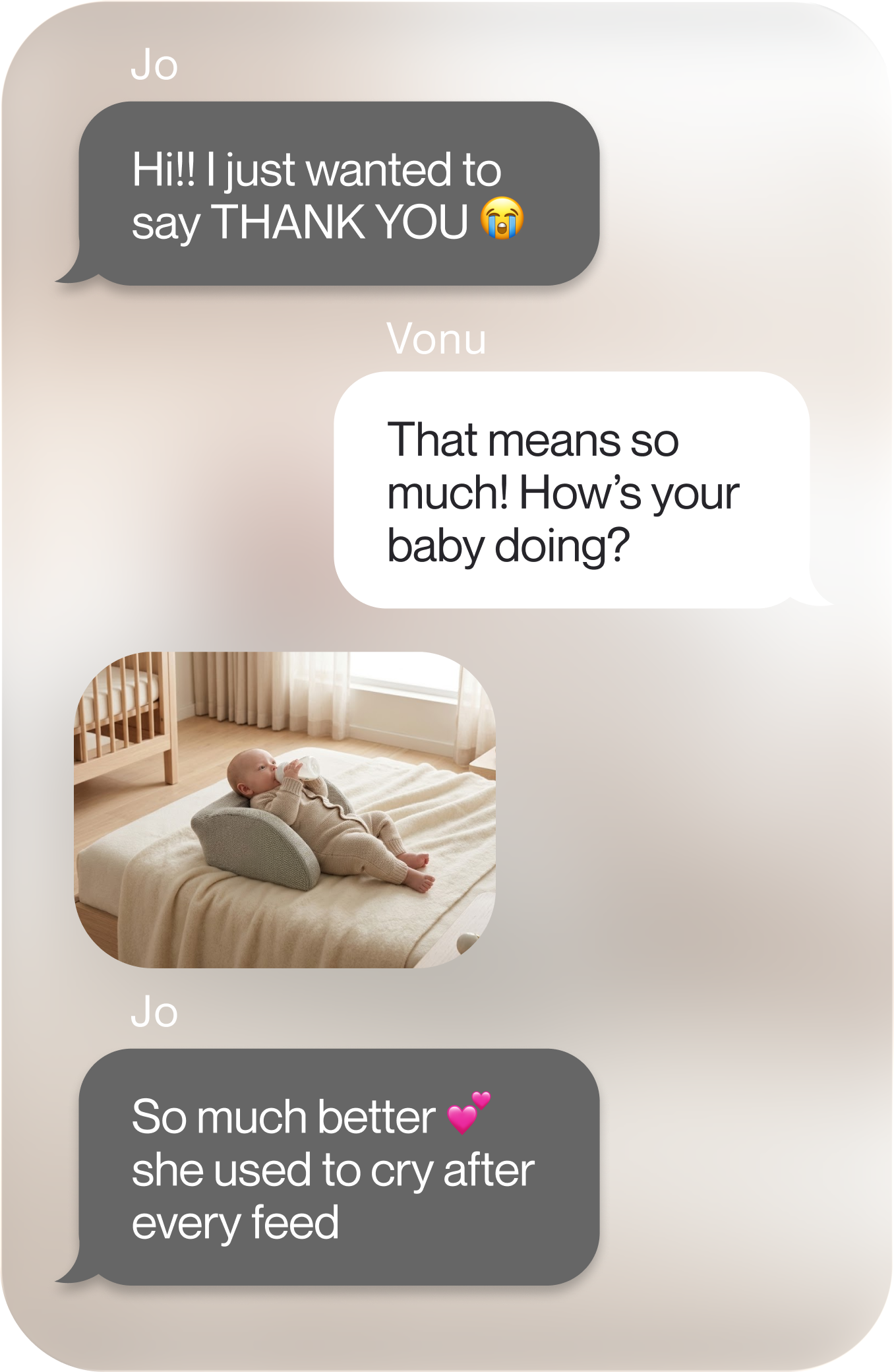 A text message conversation with a photo of a baby lying on a bed with a feeding pillow.