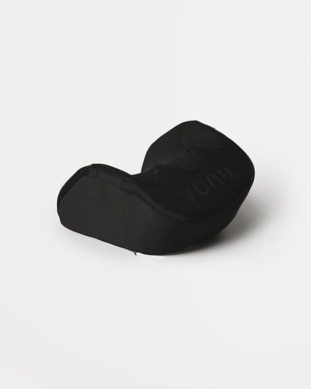 Black ergonomic cushion on a white background.