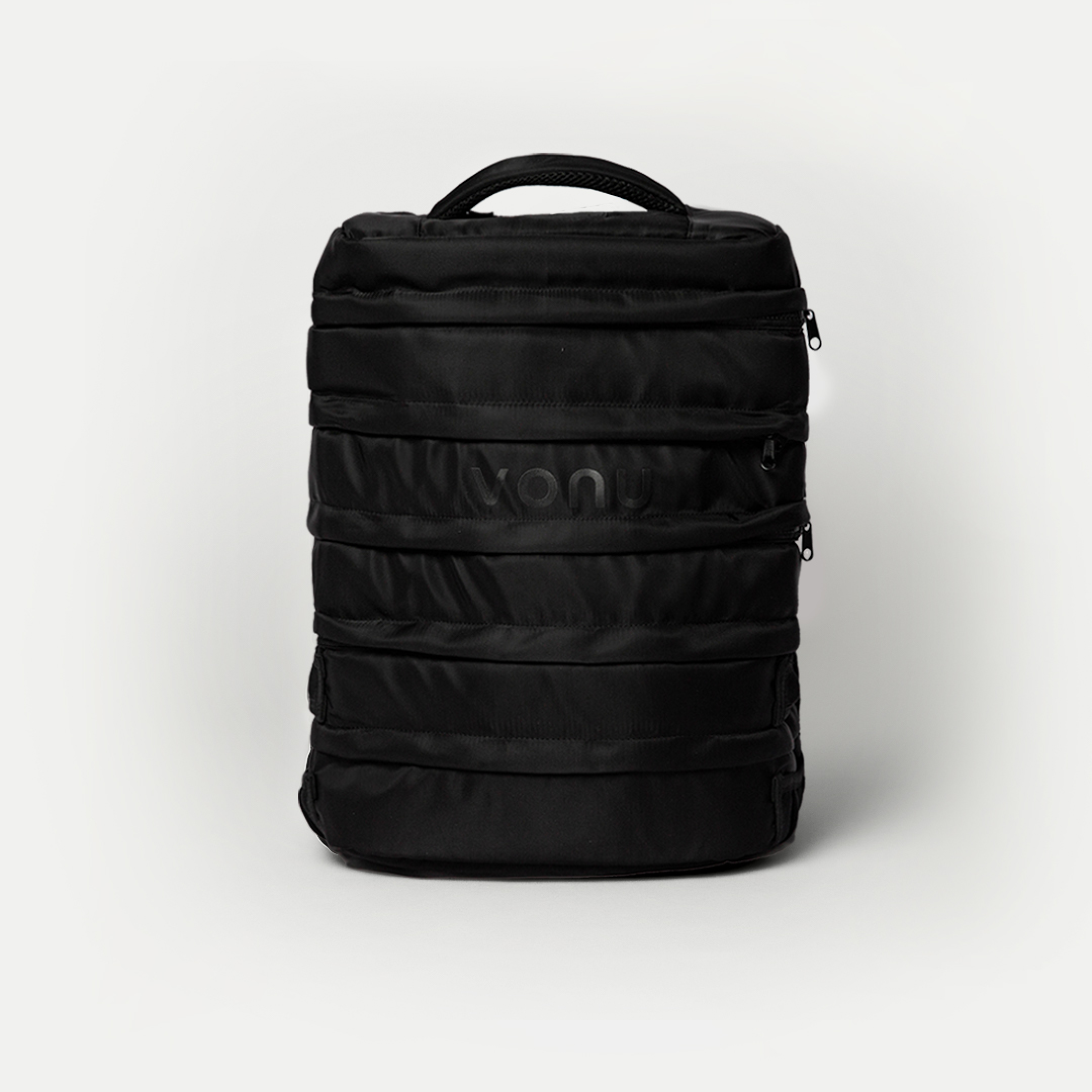 Black backpack with horizontal zippers and a top handle.