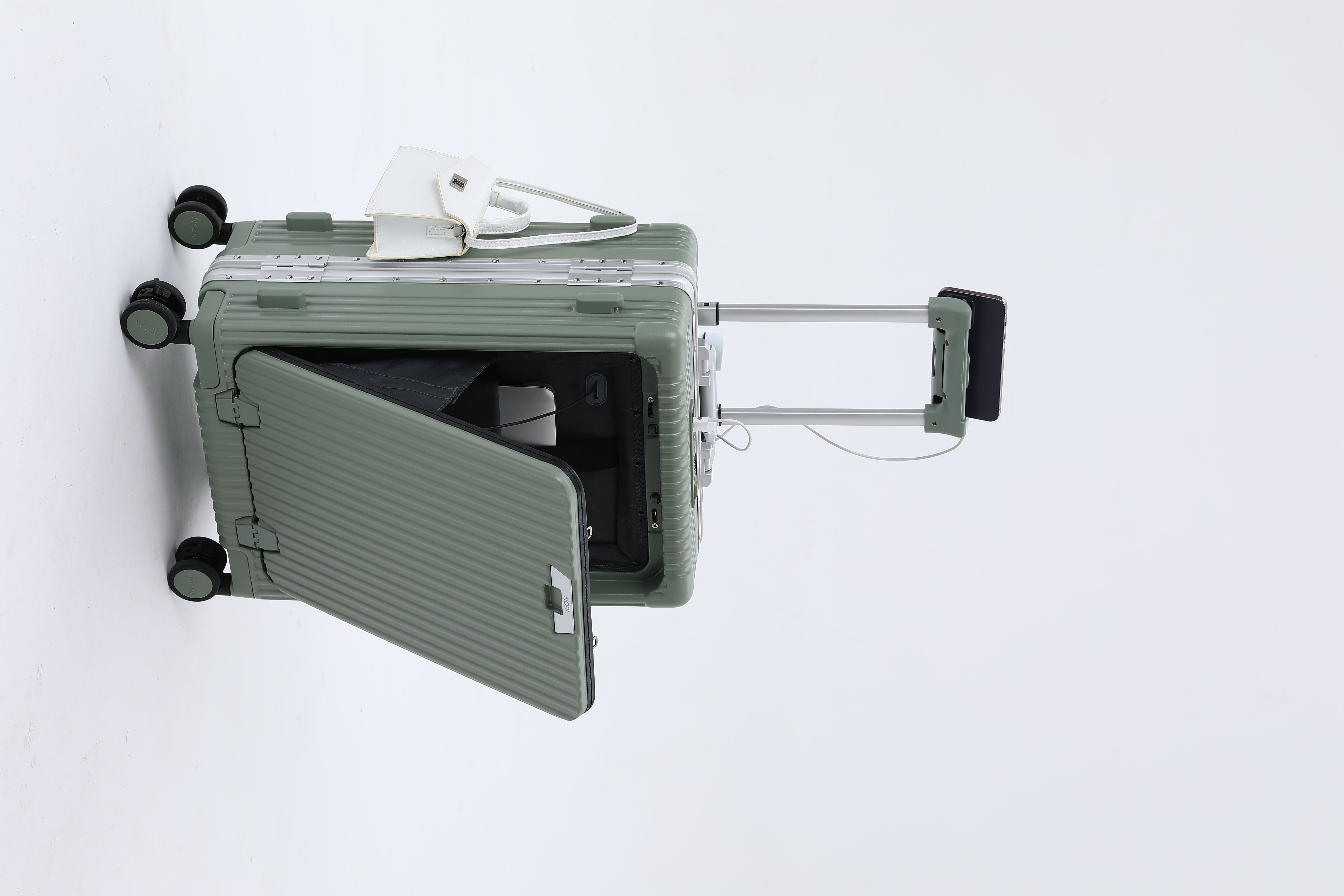 Open hard-shell suitcase with a handle and attached small white handbag.