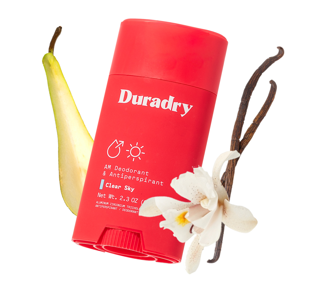 Red deodorant stick with pear, vanilla flower, and pods.