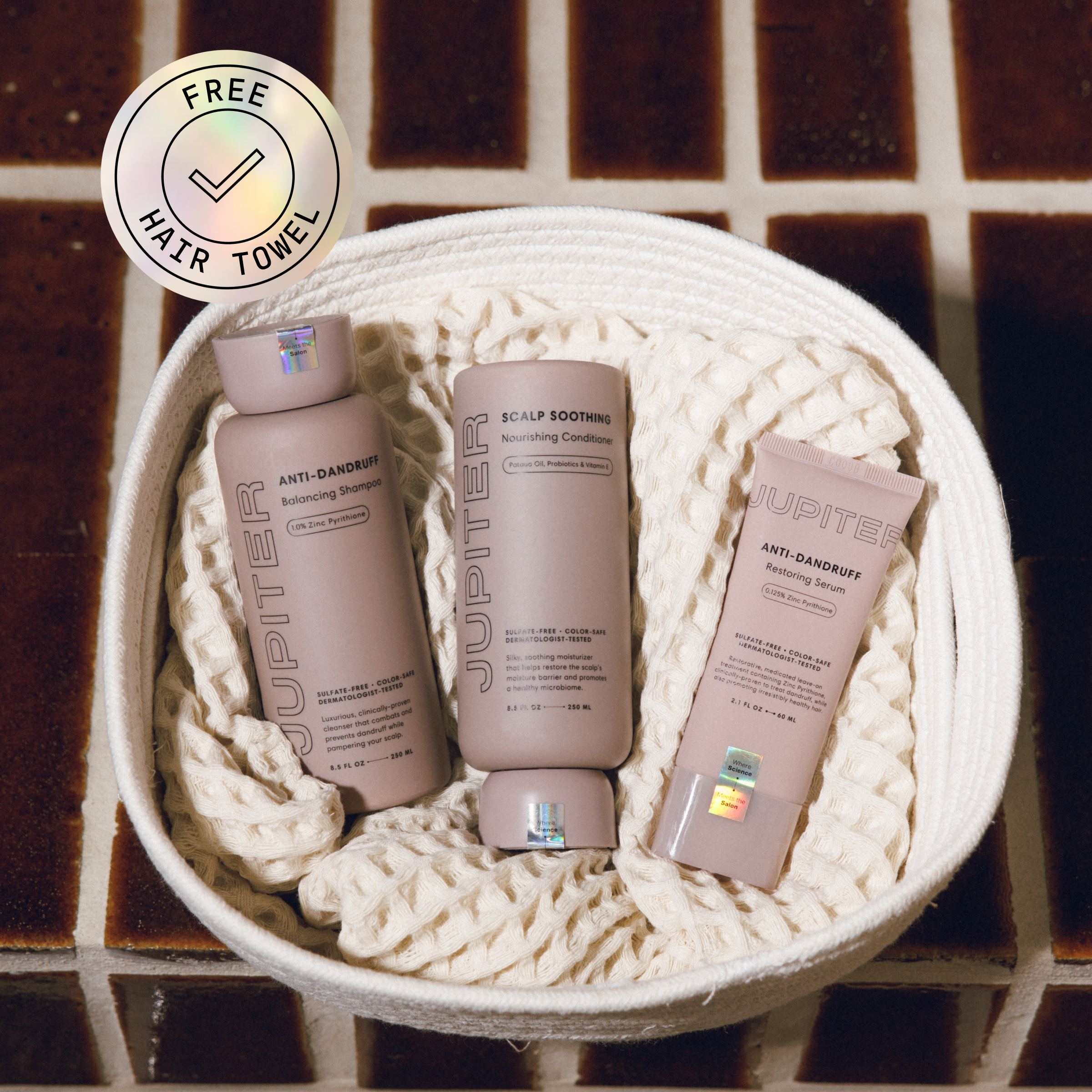 Basket with Jupiter hair products and free hair towel badge.