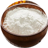 A wooden bowl filled with white powder, possibly flour.