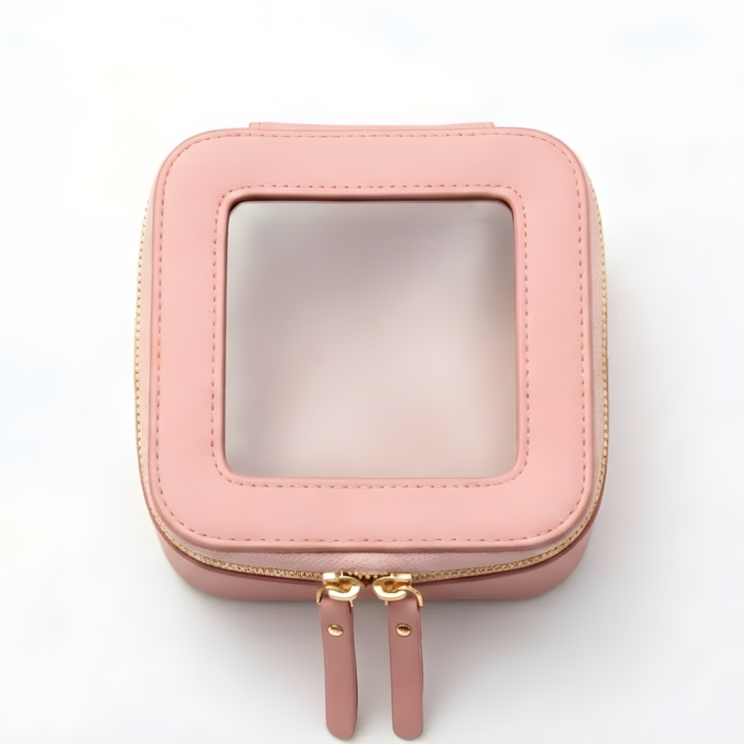A square pink zippered case with a clear top window against a white background.