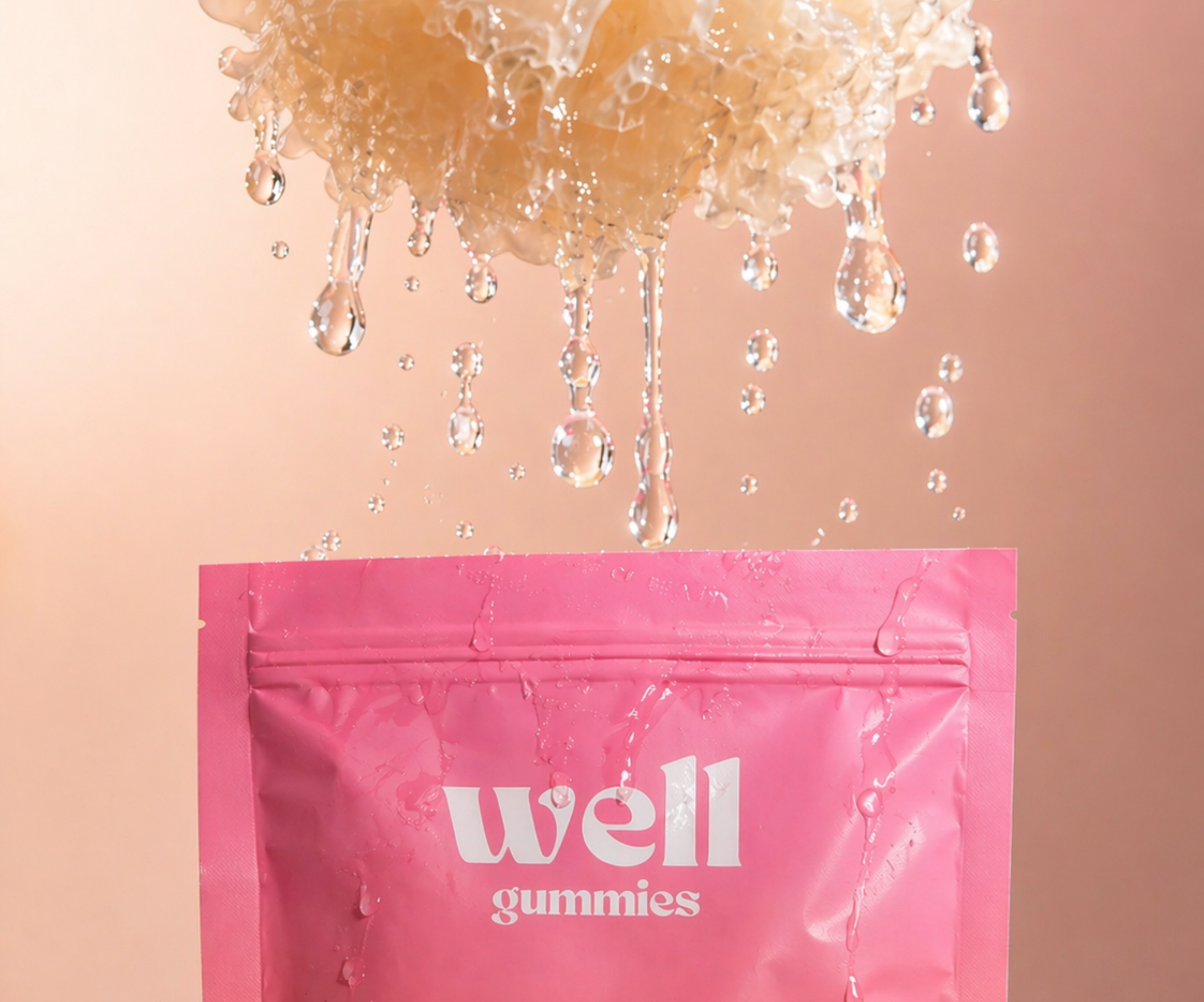 A pink pouch of 'well gummies' with a large splash of water dripping onto it from above.