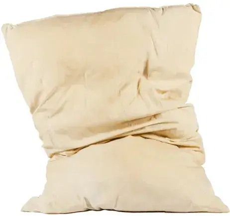 A crumpled beige pillow against a white background.