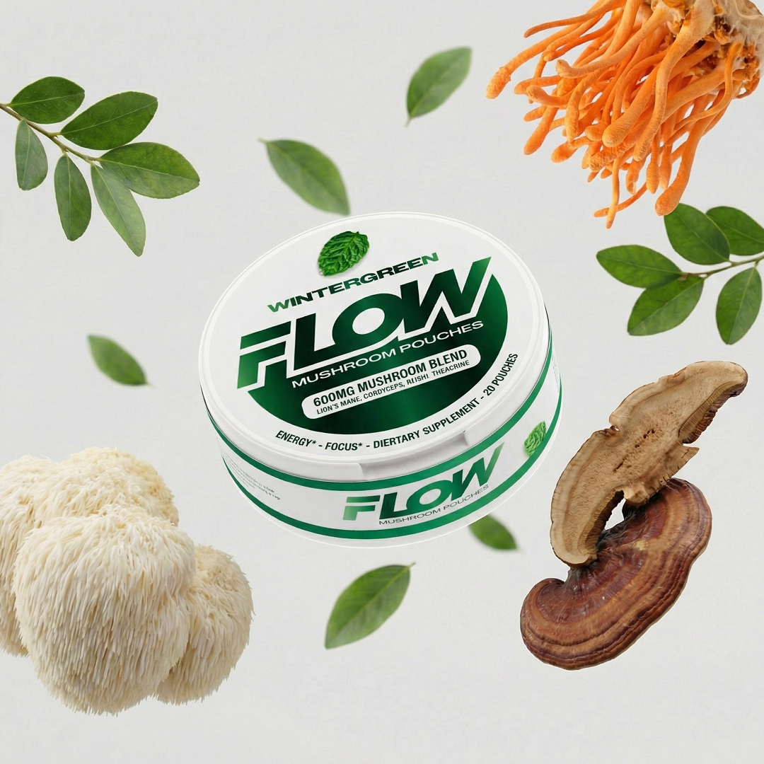 A tin of Flow Mushroom Pouches surrounded by various mushrooms and green leaves against a white background.