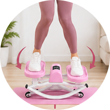 A person in pink leggings and white sneakers using a pink mini stepper machine on a pink mat.