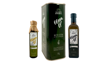 Three bottles of Zauber brand olive oil with green labels.