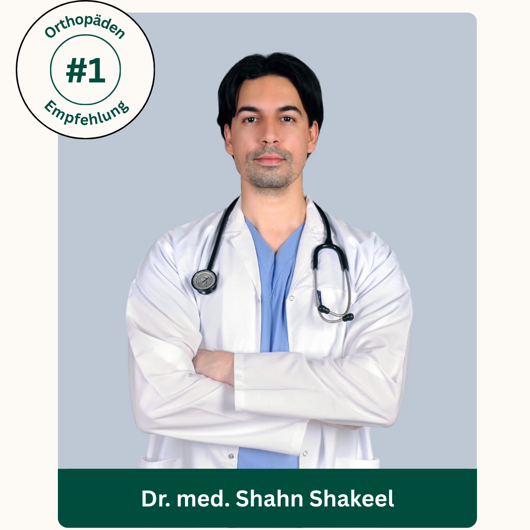A doctor in a white coat with a stethoscope, arms crossed.