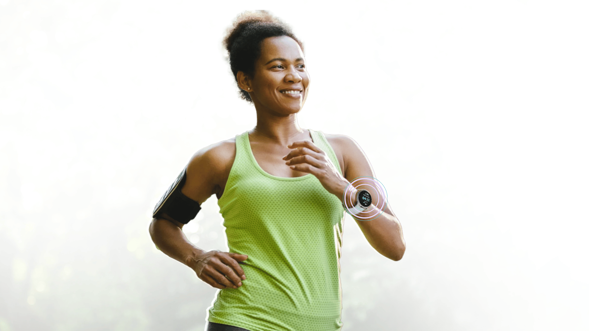 Woman jogging outdoors wearing a green tank top and a smartwatch.