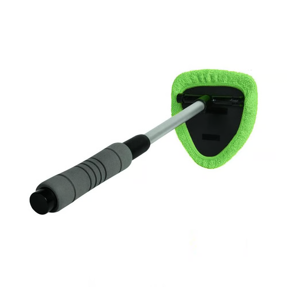Green microfiber cleaning tool with a long handle on white background.