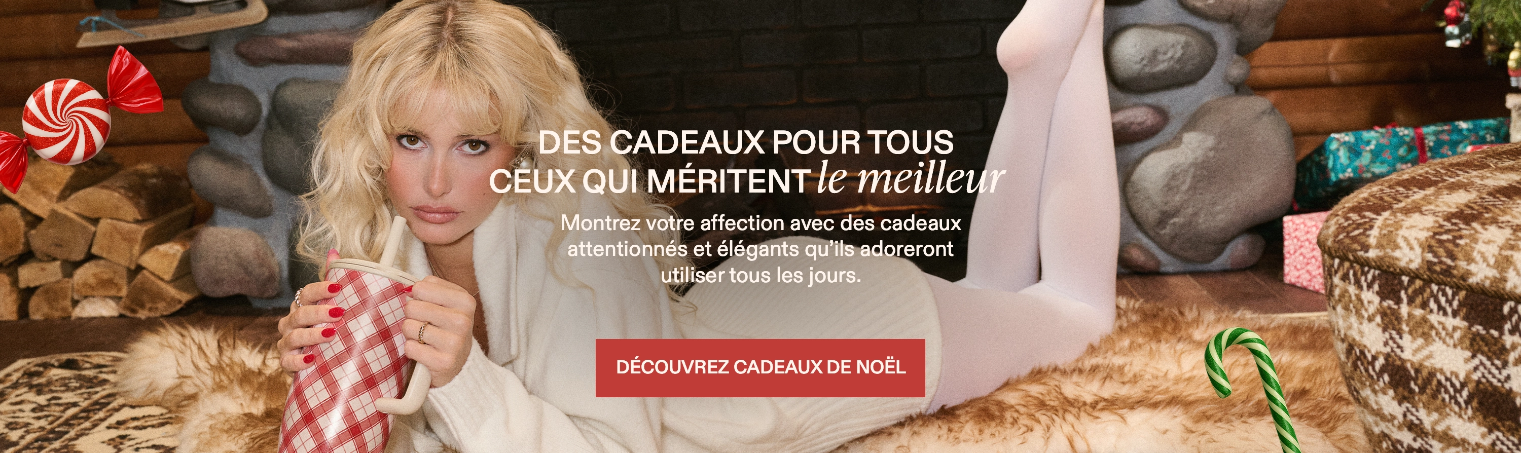 Person in cozy room with gifts and festive decorations.