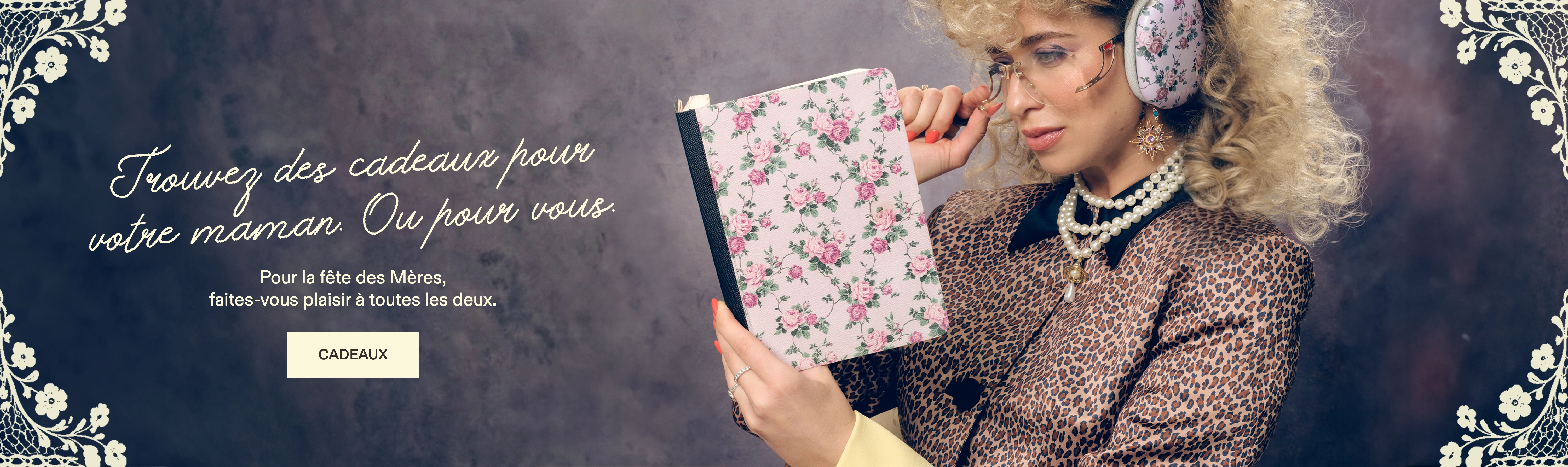 A woman with 80s-style hair and a leopard print jacket holds a floral-patterned book.