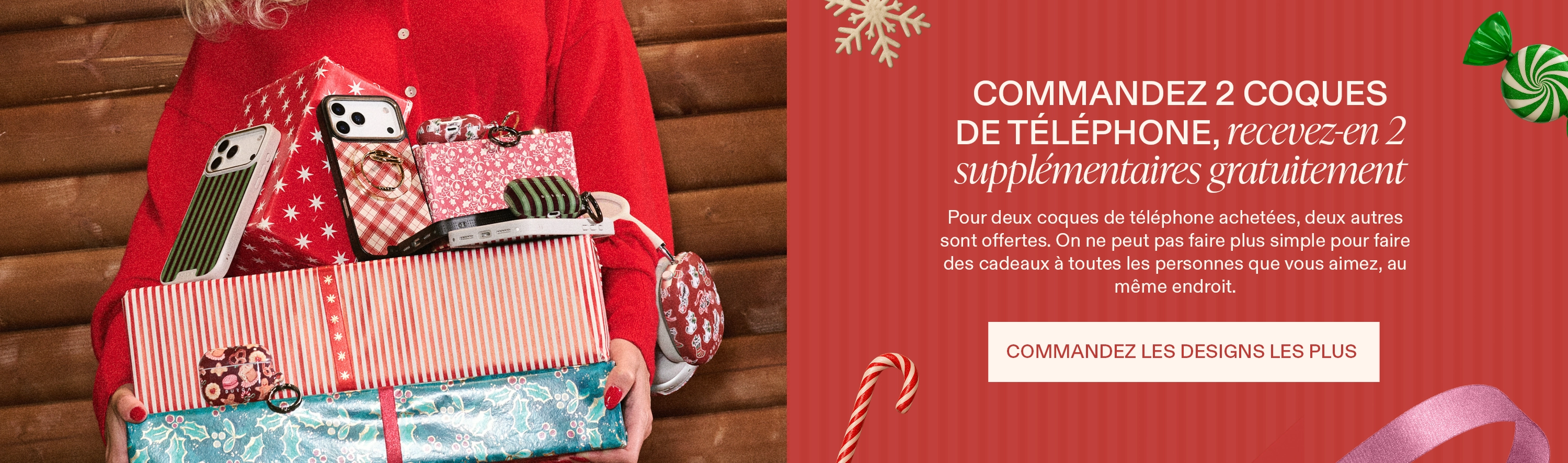 Person in red holding wrapped gifts and phone cases on a wooden background.