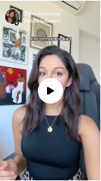 A screenshot of a social media video showing a woman talking, with a large play button icon superimposed.