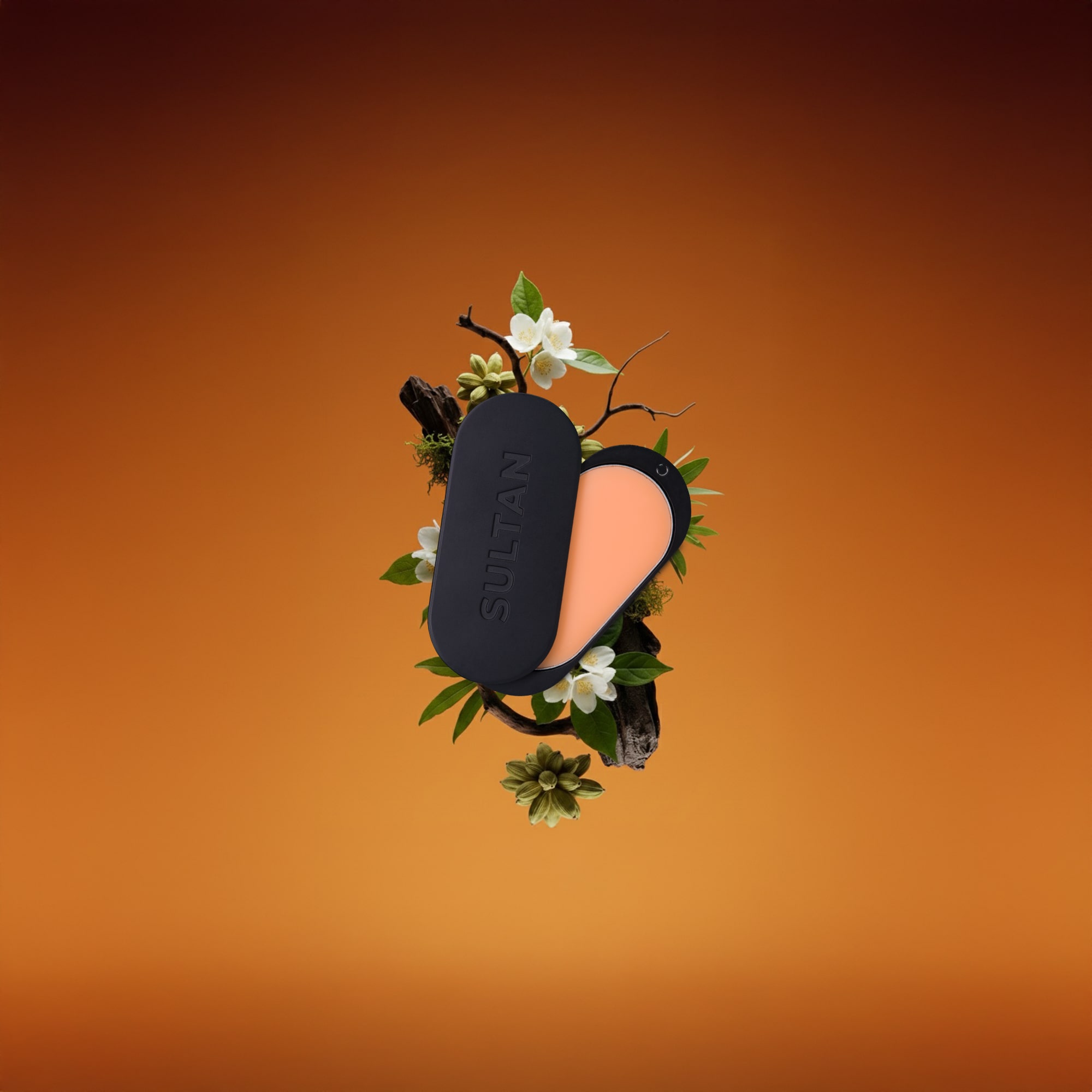 Black and orange compact makeup case with flowers on orange background.
