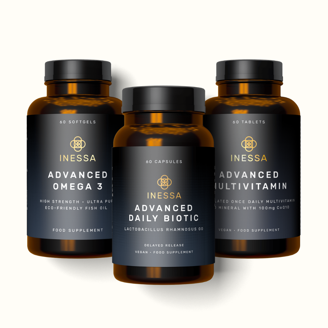 Three bottles of Inessa supplements: Advanced Omega 3, Advanced Daily Biotic, and Advanced Multivitamin against a white background.