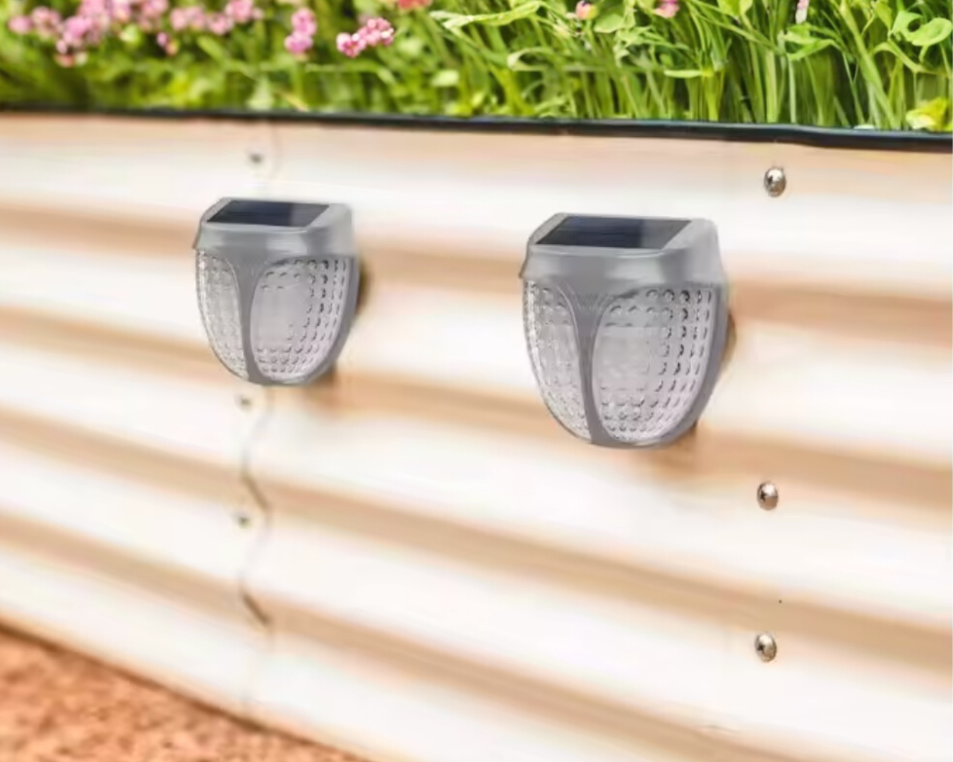 A stack of books titled 'The Type Book' beside a vase with blue flowers.