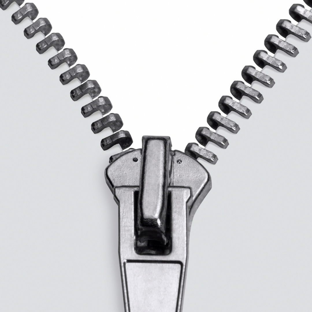 Two young trees covered in protective fabric on a grassy lawn.