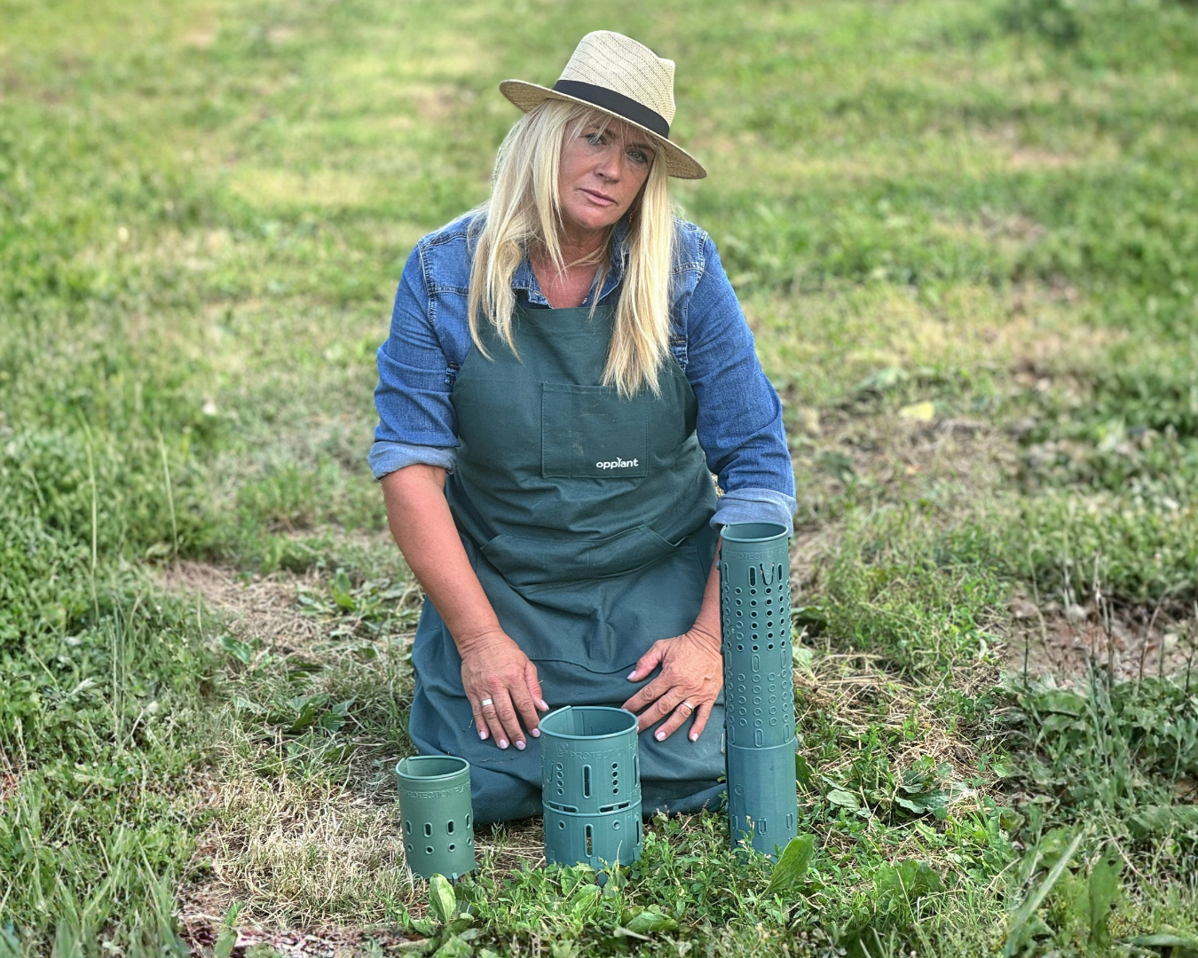 Wooden chair with white woven seat in front of sheer curtains.