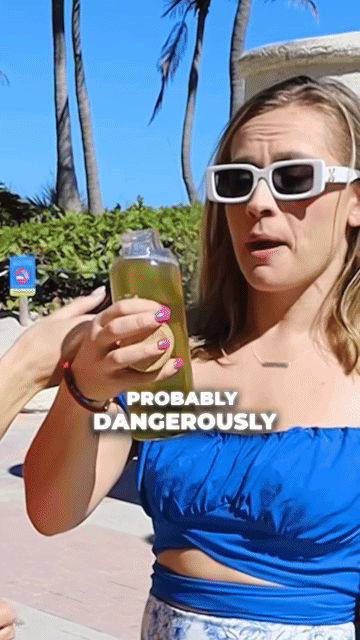 Woman in sunglasses holding a drink outdoors with text overlay 'PROBABLY DANGEROUSLY.'