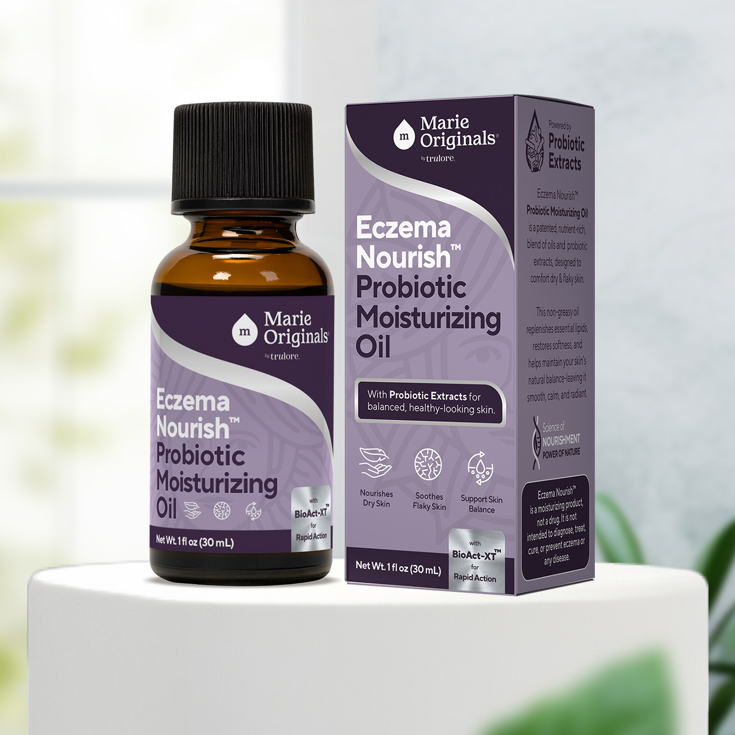A bottle and box of Marie Originals Eczema Nourish Probiotic Moisturizing Oil on a white pedestal.