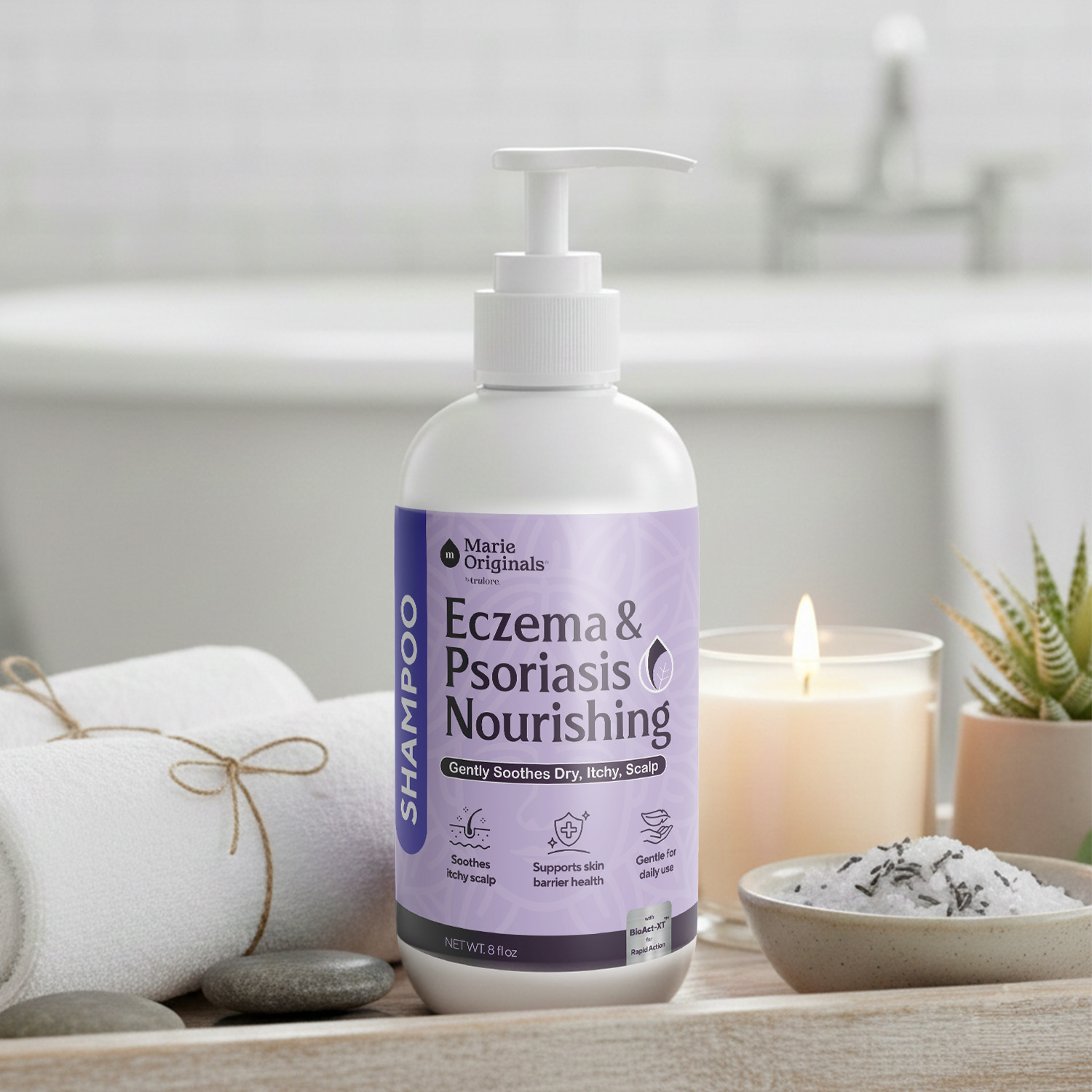 A bottle of eczema and psoriasis shampoo on a wooden tray with towels, a candle, and bath salts.