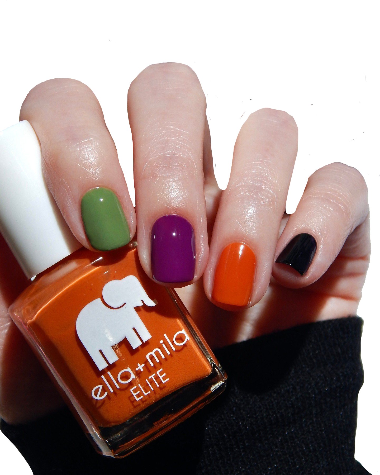 Hand with multicolored nail polish holding an orange nail polish bottle.