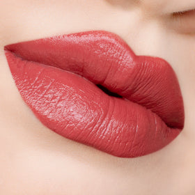 Close-up of lips with red lipstick.
