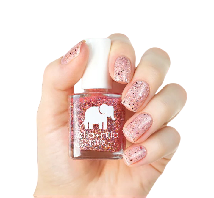 Hand holding a bottle of glittery pink nail polish.