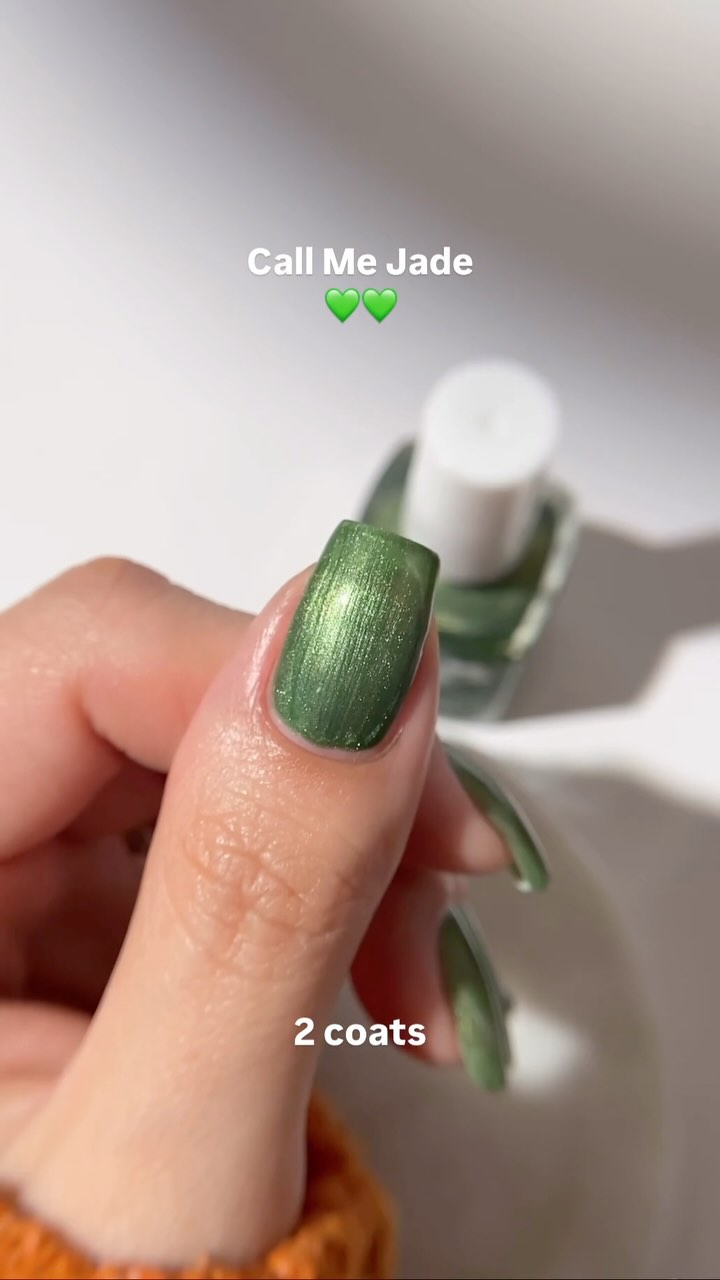 Close-up of a hand with green nail polish, text reads 'Call Me Jade' and '2 coats'.