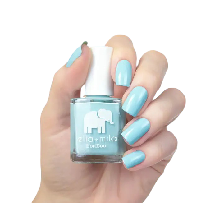 Hand holding a bottle of light blue nail polish.