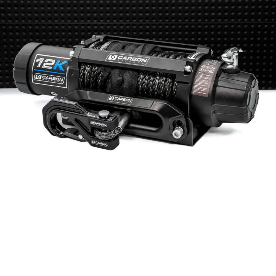 Electric winch with black housing and rope, labeled '12K Carbon Series'.