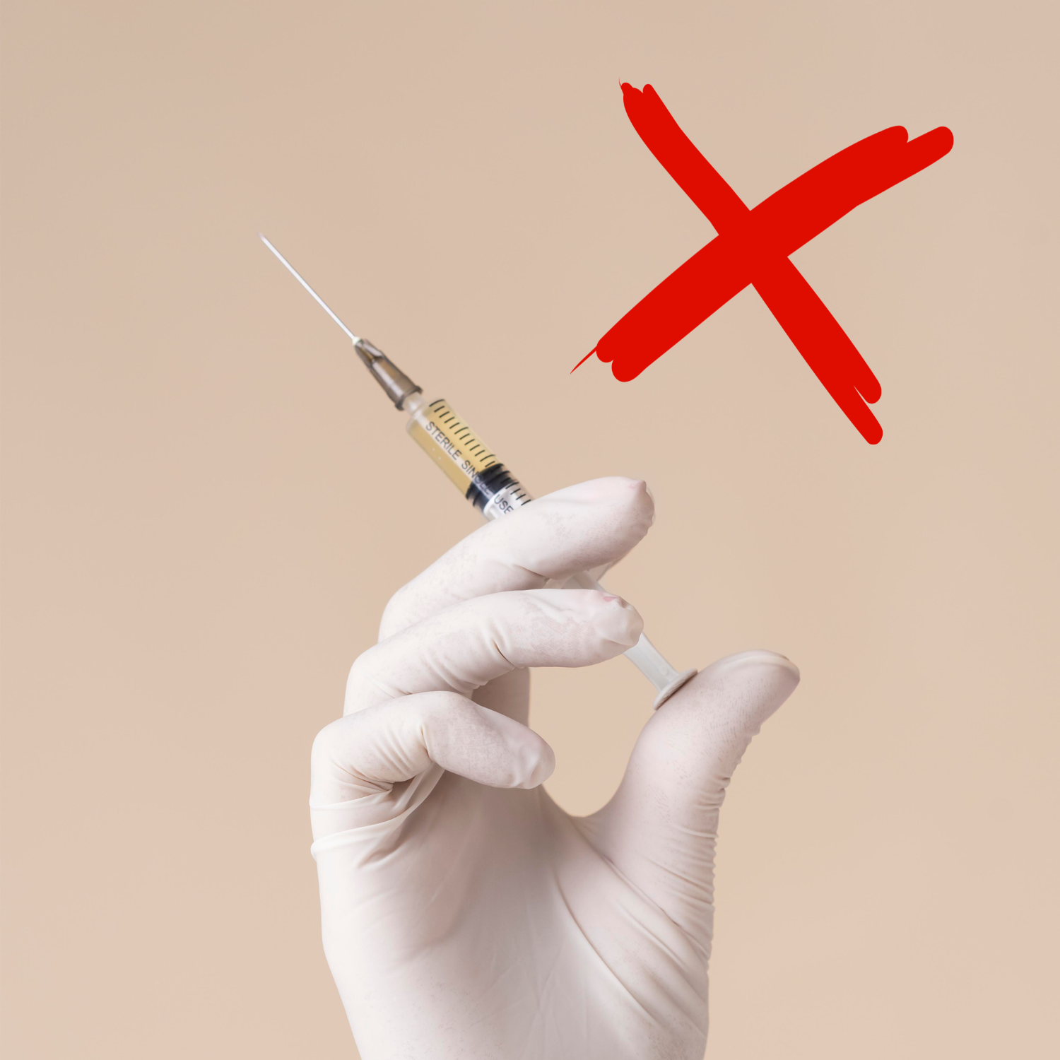 A gloved hand holds a syringe with a large, hand-drawn red X above it on a beige background.