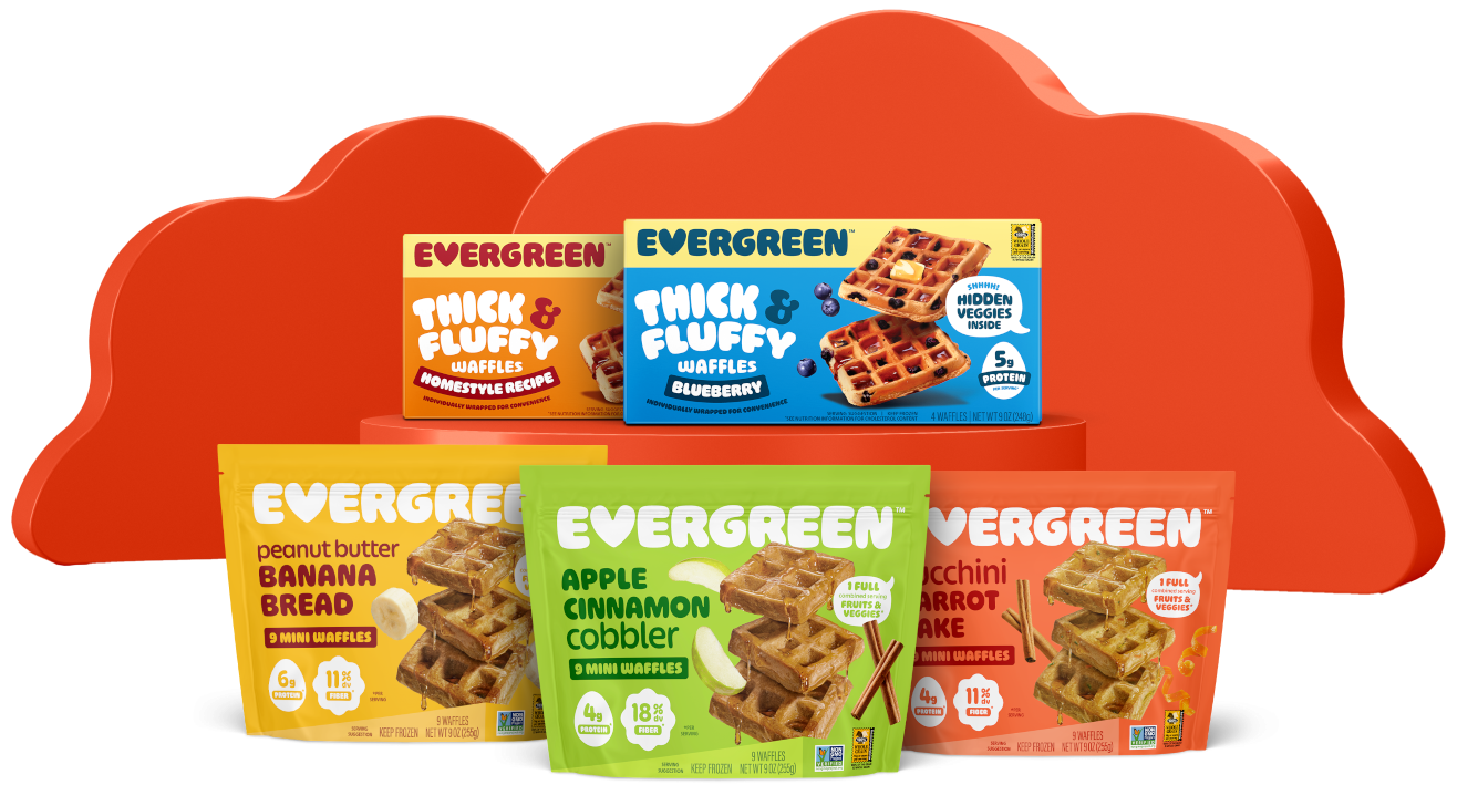 Colorful packages of Evergreen thick and fluffy waffles in front of red cloud backdrop.