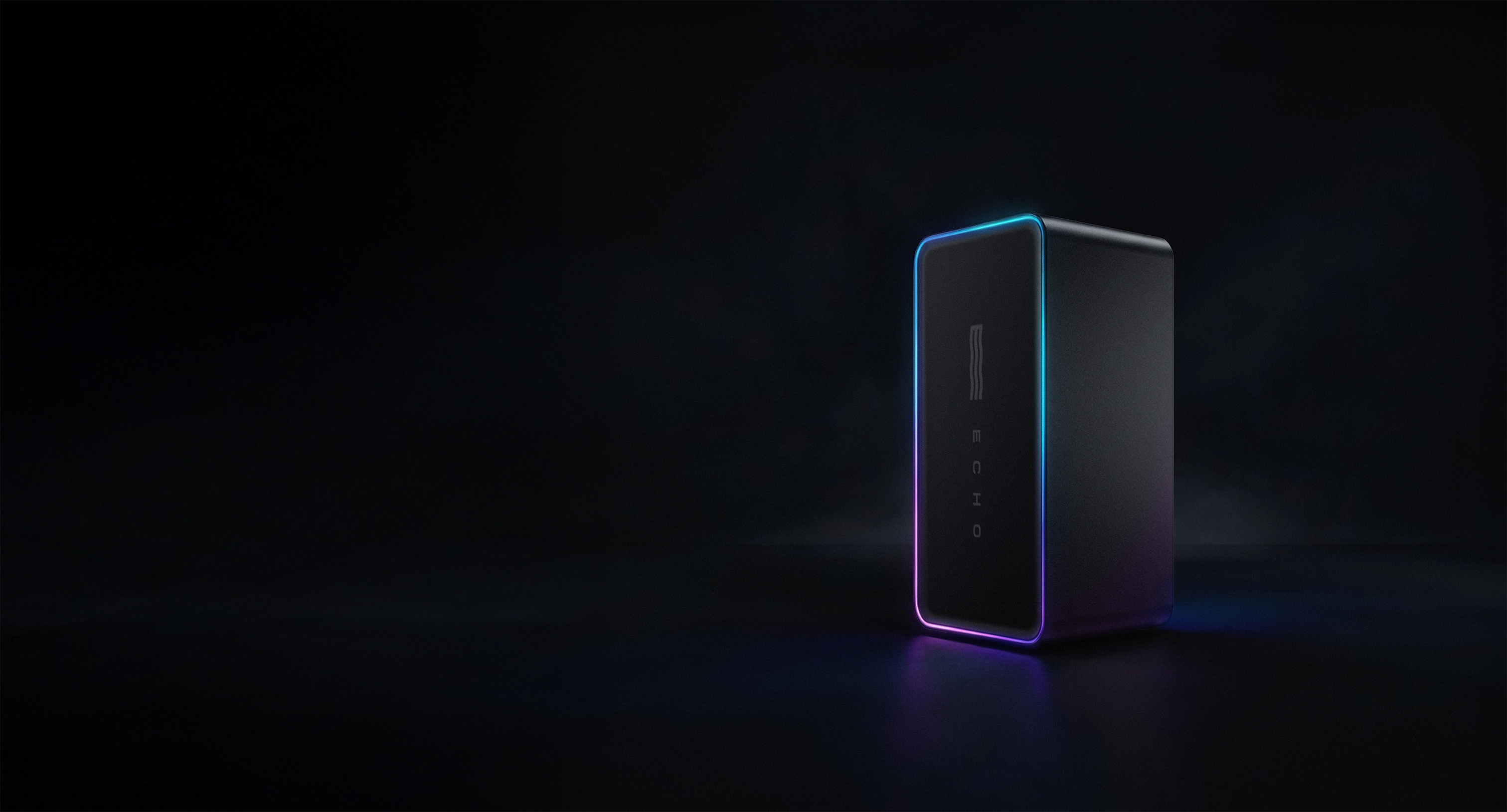 Black rectangular device with colorful LED edges against a dark background.