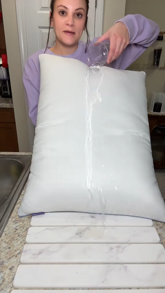 Customer pouring water on the pillow