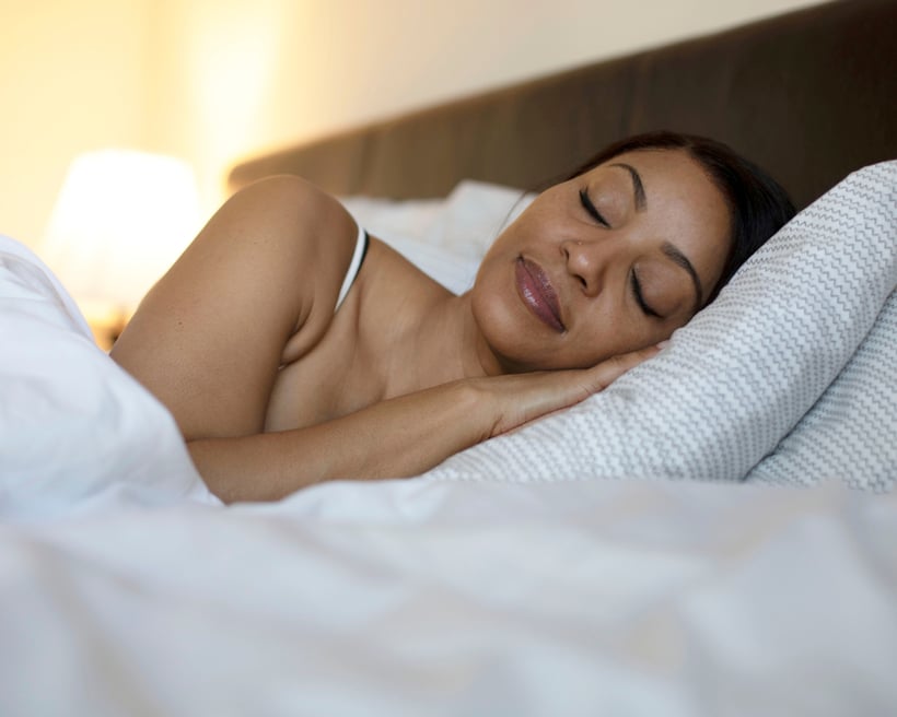 Woman resting calmly, lower cortisol