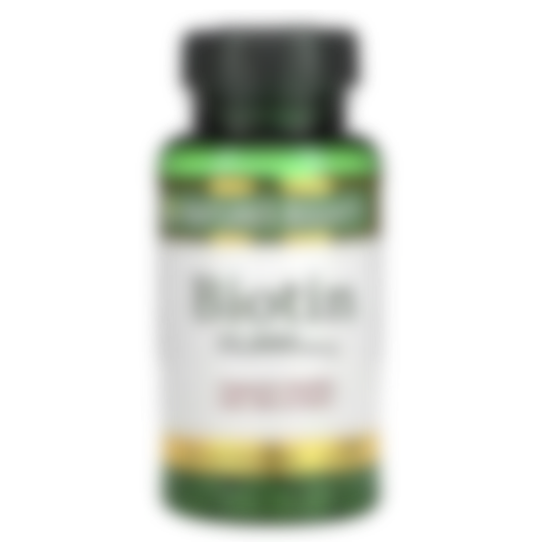 A blurred placeholder image of a green bottle with a white label and a dark cap.