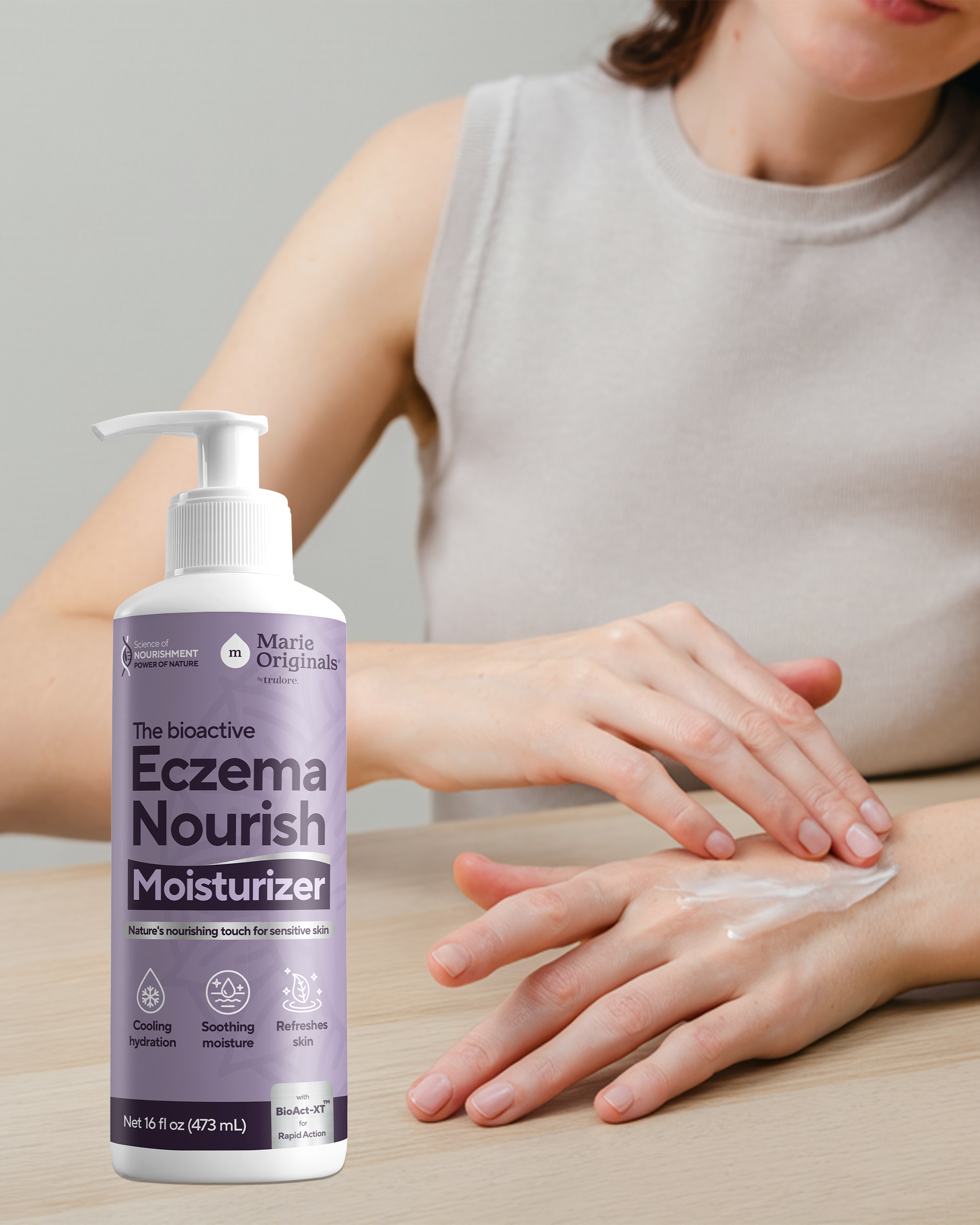 Person applying eczema moisturizer on hands, bottle in foreground.