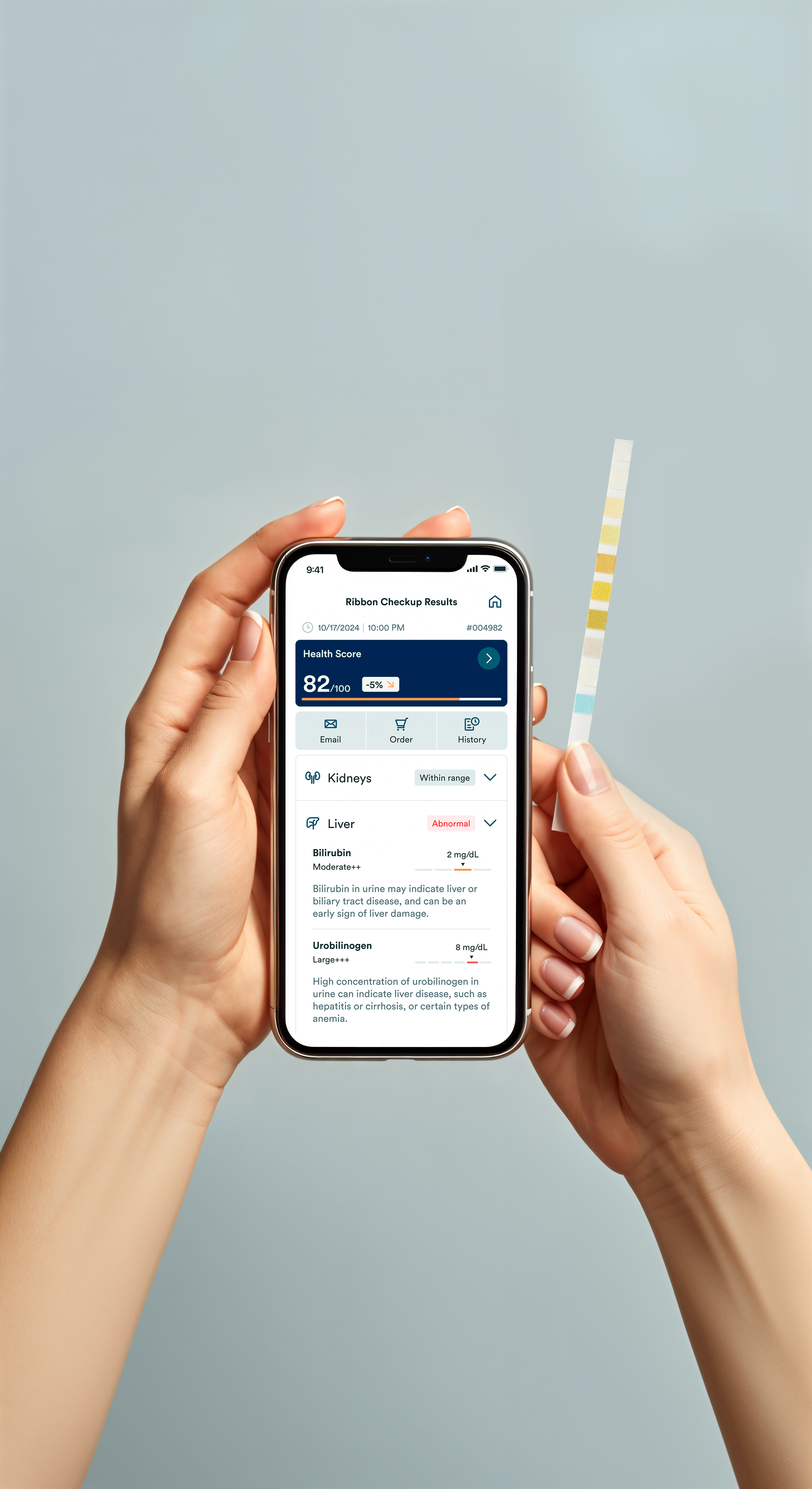 Hands holding a smartphone displaying health checkup results and a test strip.