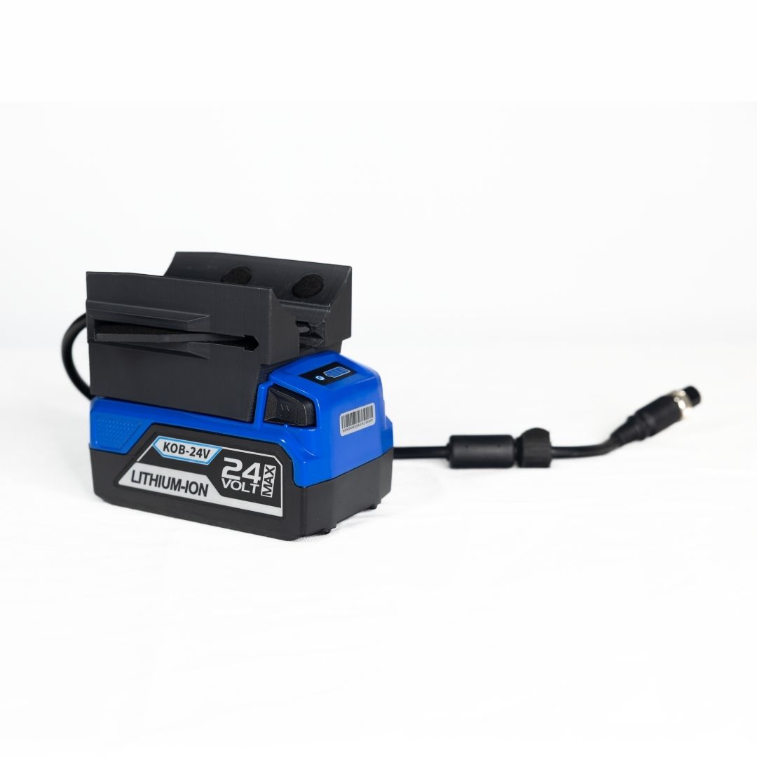 A blue and black KOB-24V lithium-ion battery pack with an adapter and power cord against a white background.