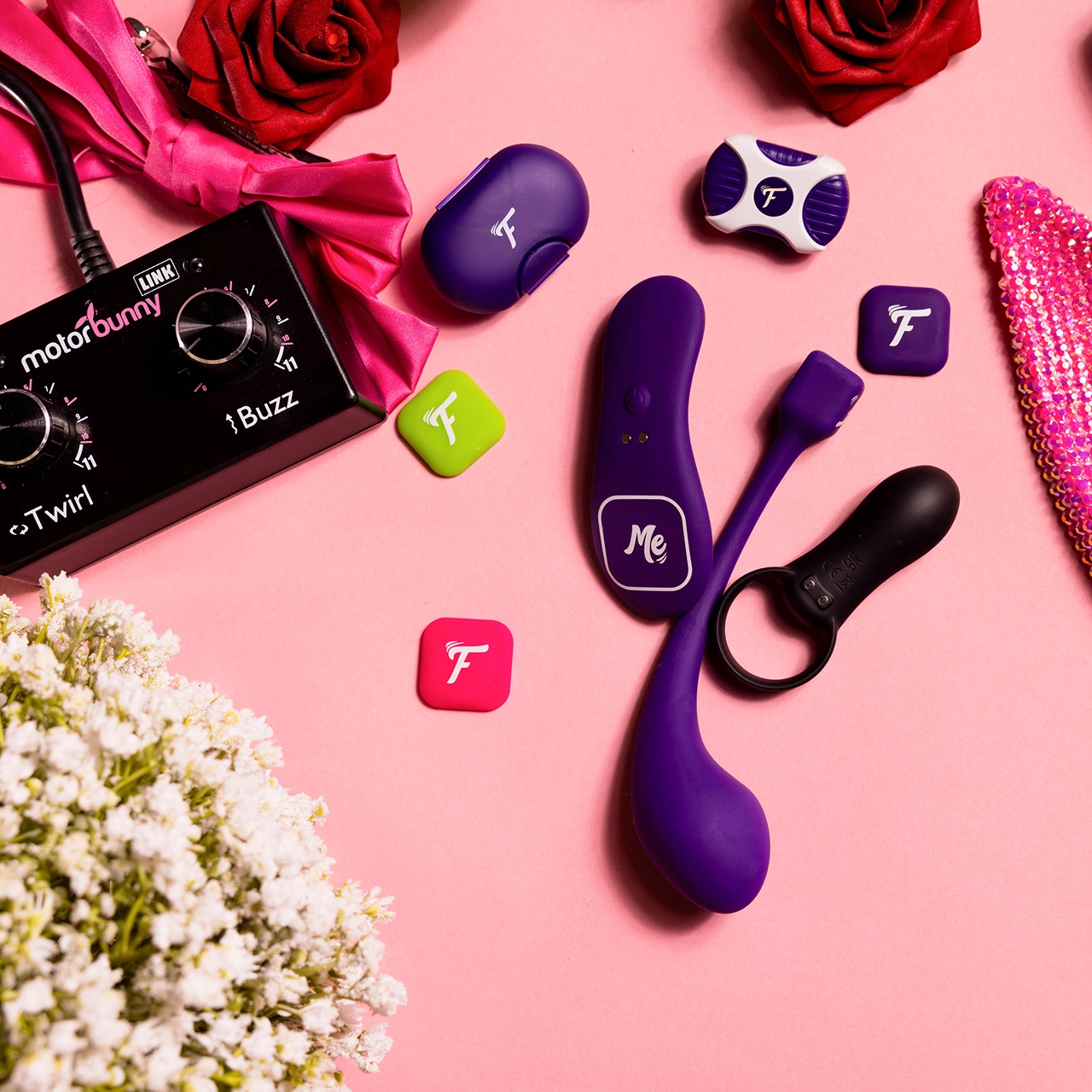
The Motorbunny Fluffer enabled toy collection on a pink background with pink bunny ear props.
