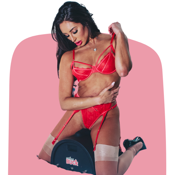 Person in red lingerie posing on a mechanical bull.