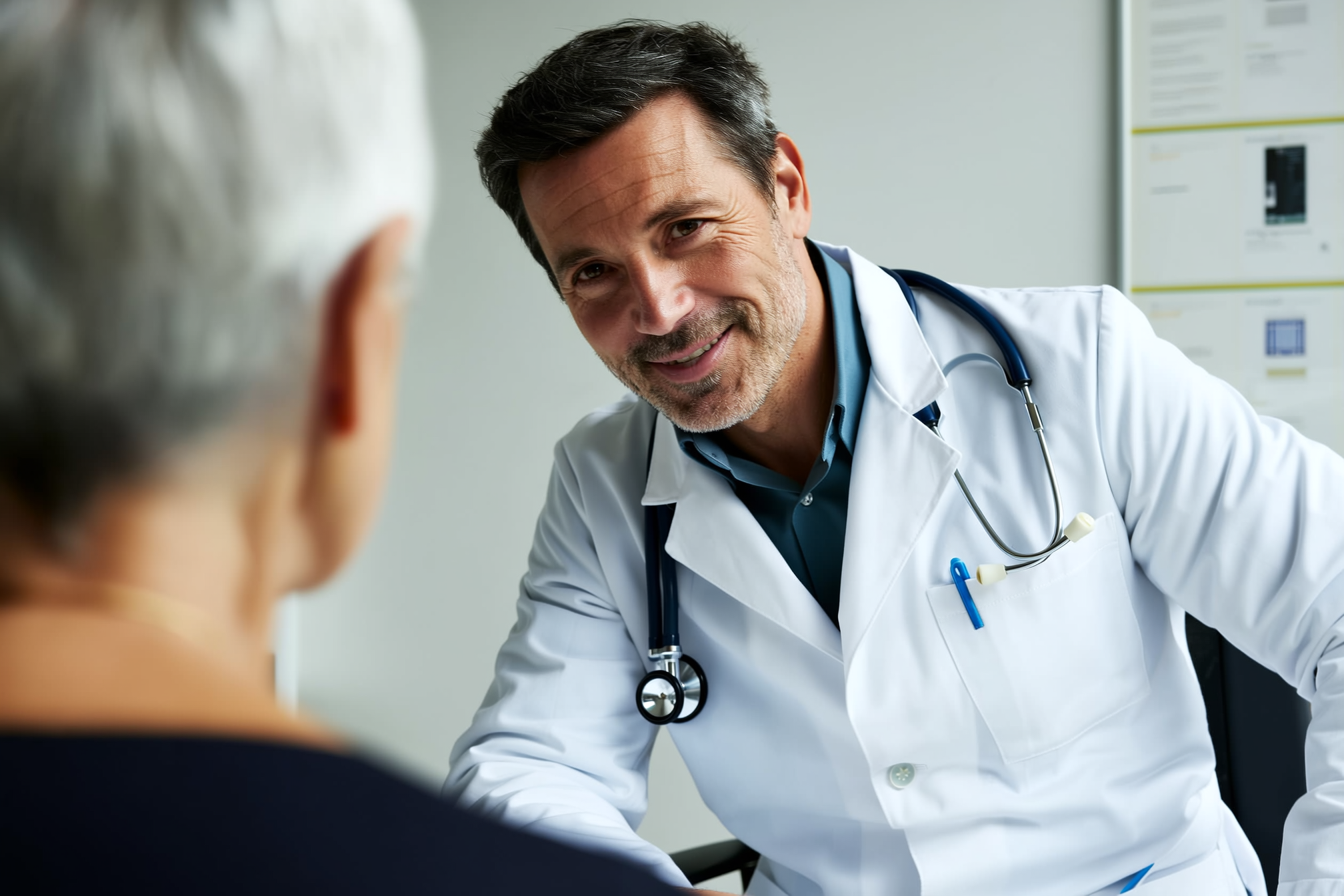 Doctor smiling at a patient during a consultation.