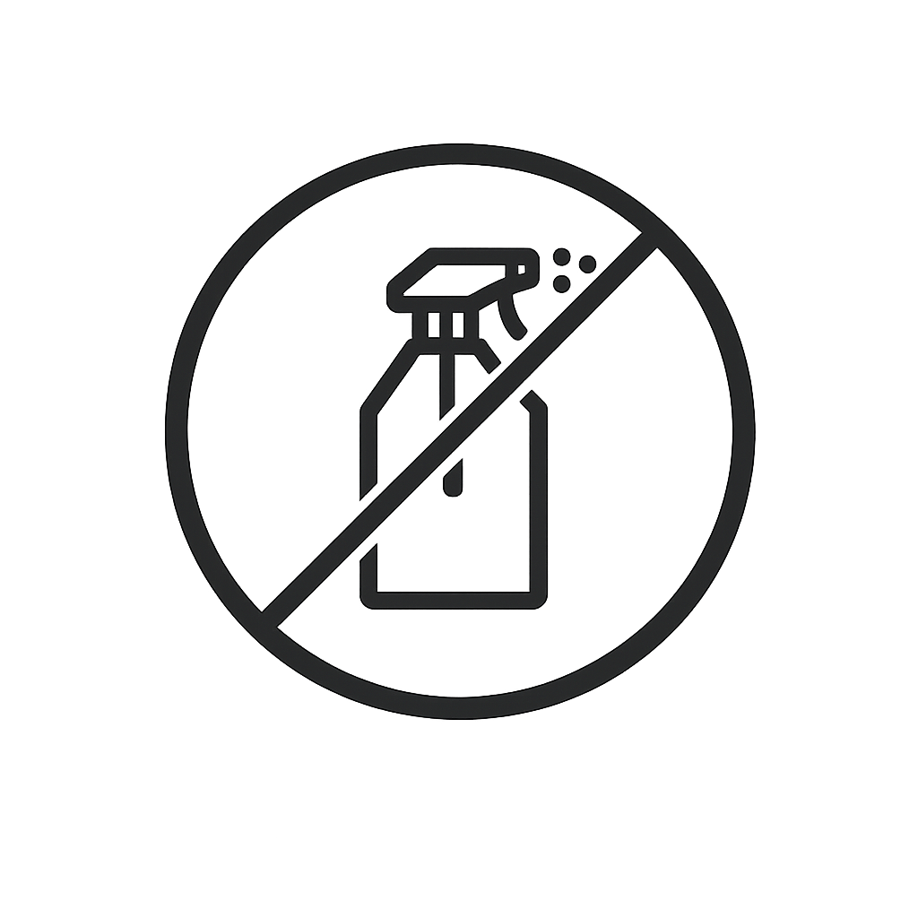 A dark gray embossed icon of a spray bottle within a prohibition symbol on a gray background.