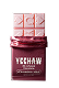 A pink Yeehaw chocolate bar is partially unwrapped from its dark red packaging.